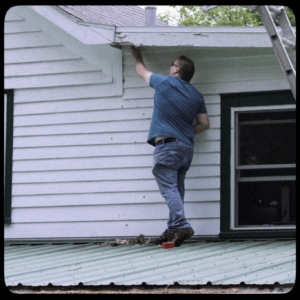 Dave scraping hornet nest off