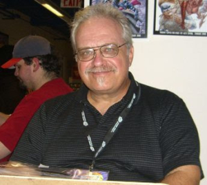 Alex Saviuk at convention booth