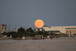 full moon looking enormous and close over Cape May, NJ