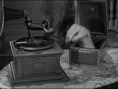 The Addams Family Thing winding the Victrola record player