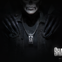 Shadowman promo banner; man in all black with long claws over his shoulders, a necklace, his face covered in white and black skull makeup