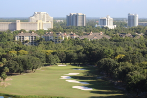 view from hotel balcony overlooking golf course and other hotels