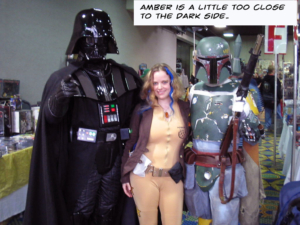 Amber in costume between Darth Vader and Boba Fett