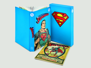 DC: Superman hard cover book standing upright next to the box sleeve and a reproduction of Superman #1 by the Folio Society