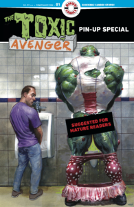 The Toxic Avenger pin-up special showing a normal man at a urinal looking over at Toxic Avenger at the urinal next to him (with his tutu and tights down) and a "Suggested for Mature Readers" stamp over his butt.