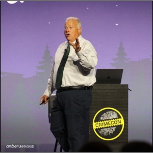 Mike King on stage at CrimeCon talking about the LDS cults