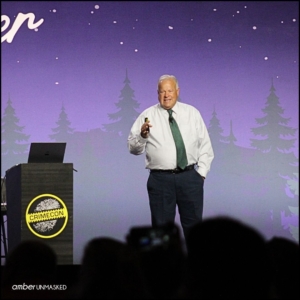 Mike King on stage at CrimeCon talking about the LDS cults