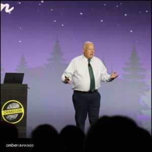 Mike King on stage at CrimeCon talking about the LDS cults