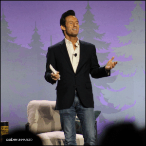Jesse Weber standing on the stage at CrimeCon