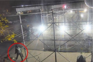 CCTV Luigi Mangione circled in red, wearing a backpack, at a NYC corner