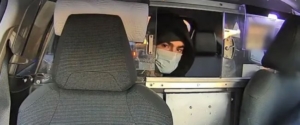 Luigi Mangione photo captured of him looking through a taxicab divider window.