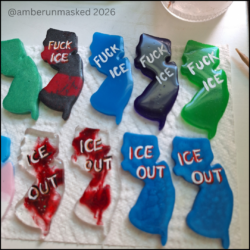 multicolored resin pins in the shape of New Jersey with hand-painted text, "Fuck ICE" or "ICE out."